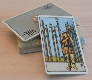 Tarot Deck Nine of Wands scaled e1726964996382 300x260 - 2025 Psychic Astrology Predictions